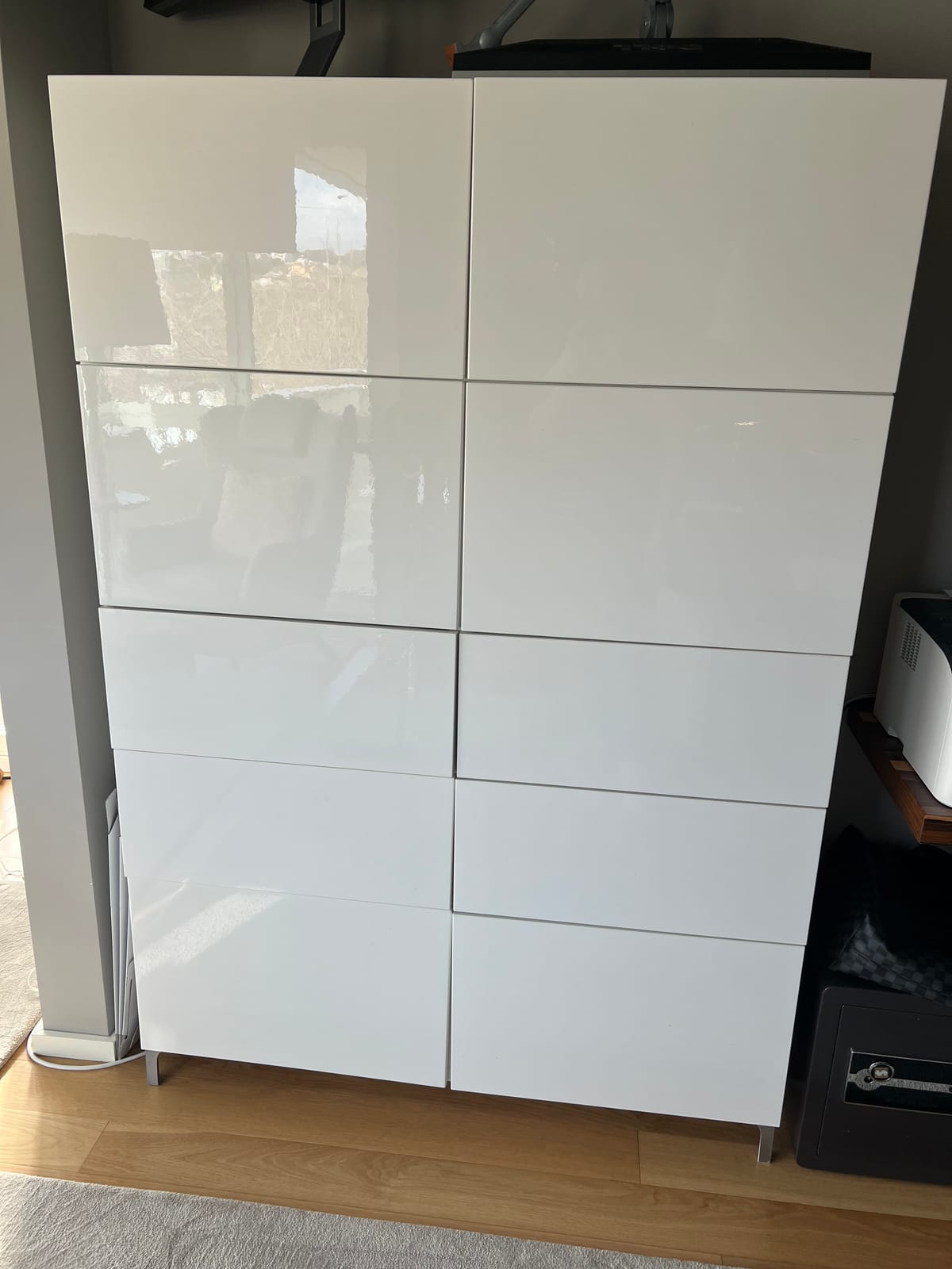 Various Ikea Besta cabinets with doors and shelves