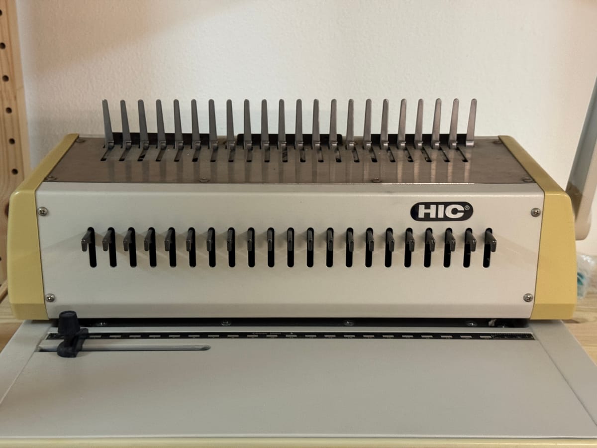 Binding machine with plastic sheets & binds